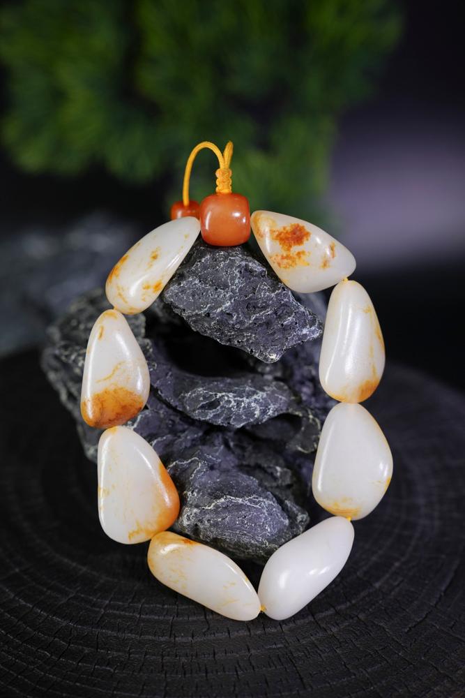 新疆和田玉白玉带红皮籽料原石手串（yc229714）