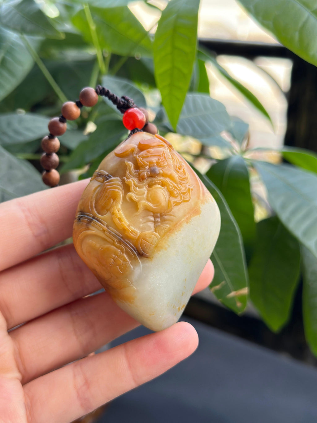 新疆和田玉珍品白玉聚黄皮籽料钟馗手把件（yc710400）